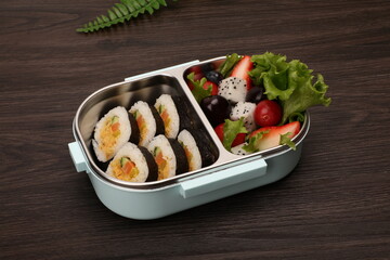 Lunch box with sushi and vegetable