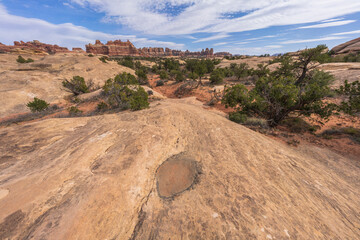 hiking the chesler park loop trail in the needles in canyonlands national park, usa