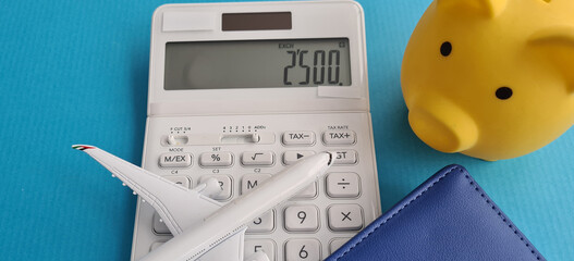 Saving travel budget and airfare closeup concept