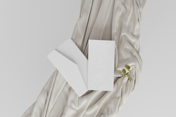 Blank envelope beside one sheet of blank paper for mockup on top of beige satin material with some small piece of leaves. 3d rendering