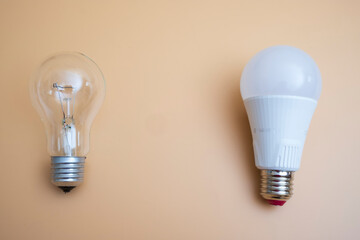 Electric light bulbs. energy efficiency concept. LED lamp vs incandescent lamp. Composition on a yellow background. Use economical light bulbs.