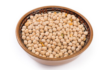 Raw yellow whole peas in bowl on a white background
