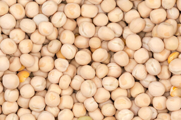 Raw yellow whole peas, top view close-up