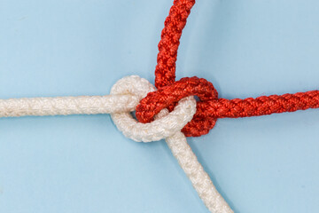 Rope Hunter knot on a blue background close-up
