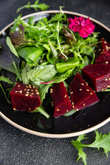 beet salad beetroot pieces mix green lettuce healthy meal food snack on the table copy space food background rustic top view