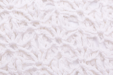 Background of knitted fabric with a pattern. Weaving winter clothes close-up.