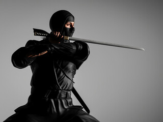 A ninja holding a ninja sword. 3D illustration. © pictosmith