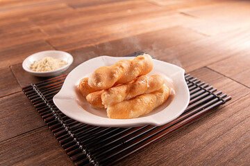 Crispy sugar dumplings served dish isolated on wooden table top view of Hong Kong food