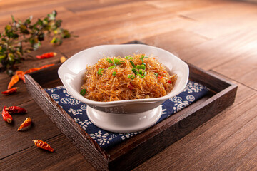 Spicy ants on the tree noodles served dish isolated on wooden table top view of Hong Kong food