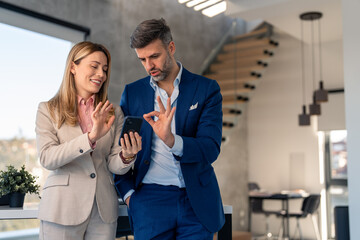 Coworkers business professionals man and woman in suit working together in office, brainstorming,...