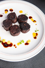 black pudding snack or bloody sausage fresh meal food on the table copy space food background rustic top view