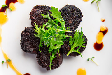 black pudding snack or bloody sausage fresh meal food on the table copy space food background...