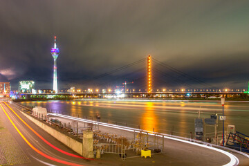 Dusseldorf, Germany-night-scene-includes media-tower and bridge on the rhine river