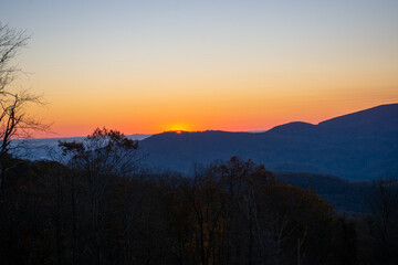 First peek of the sunrise as the sun begins to appear on the horizon in North Carolina