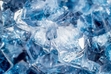 Blue Crystal Mineral Stone. Gems. Mineral crystals in the natural environment. Texture of precious and semiprecious stones. Seamless background with copy space colored shiny surface of precious stones