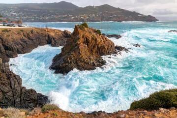 The rocky, scenic coastline along the Pacific Ocean at the cape of Punta Banda, southwest of the...