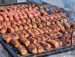 Mititei( ground meat rolls) made from a mixtue of beef,lamb with spices on the grill. Traditional romanian dish