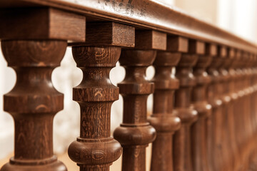 Wooden balusters, classic railings close up photo, selective focus