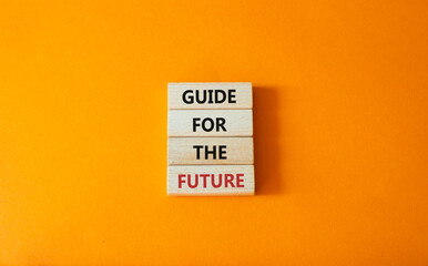 Guide for the future symbol. Wooden blocks with words Guide for the future. Beautiful orange background. Business and Guide for the future concept. Copy space.