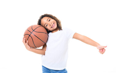 Adorable black little girl with beautiful hairstyle have fun in sport clothes play basketball