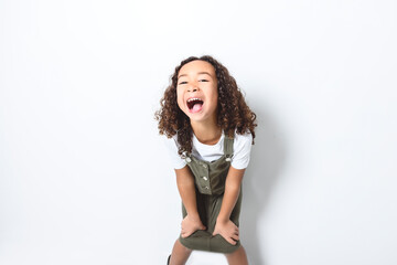Adorable black little girl with beautiful curly hairstyle isolated over white