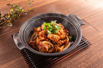 Spicy Chicken Casserole served dish isolated on wooden table top view of Hong Kong food