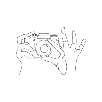 recommend clip art: Hands holding photo camera and making pictures. One line art drawing. Photographer taking photo. Hand drawn vector illustration.