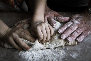 hands baking bread together