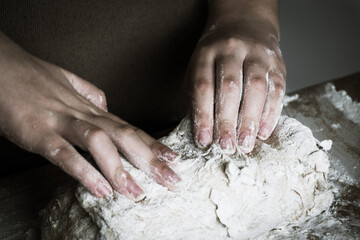 hands baking bread together