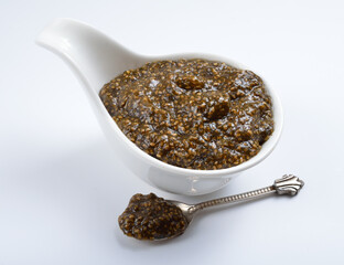 Chia seeds caviar with laminaria on white background
