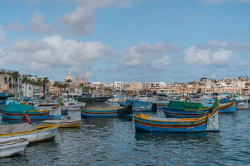 Fototapeta na wymiar Fishing boats in the harbor of Malta