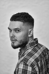 bearded man looking at camera on white background