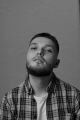 bearded man looking at camera on white background
