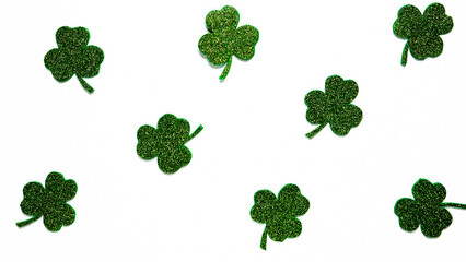 Happy St. Patrick's Day banner.Holiday background.St Patricks Day frame against a white background. Flat lay shamrocks.Copy space.Patrik's day banner