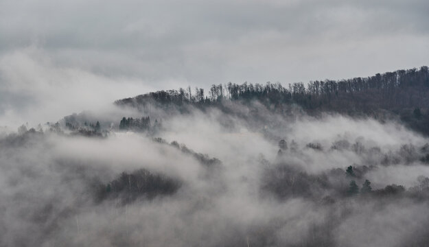 Bieszczady mountains. Cloudy sunrise in the mountains. Moody morning in the mountains. Sun through the clouds in the mountains. Sunrays in mountains. © Grzegorz