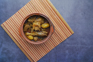 Chicken curry or masala in a bowl on table 