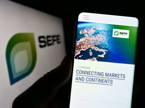 Stuttgart, Germany - 01-24-2023: Person holding cellphone with website of company SEFE Securing Energy for Europe GmbH on screen with logo. Focus on center of phone display.