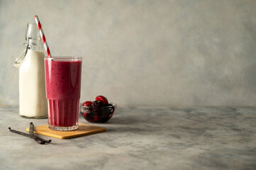 Berry smoothie milk shake drink with fresh fruits. Healthy eating copy space.