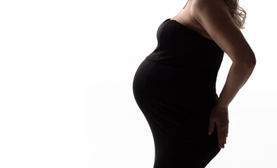 banner. without a face. a pregnant woman in a black dress on a white background