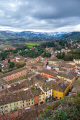 Fototapeta na wymiar Cityscape from above of little city Brisighella, province of Ravenna, Romagna, Italy, in a winter snowy day