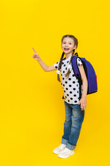 A little girl with a briefcase points to your advertisement, a smiling girl with a briefcase behind her goes to additional courses, additional classes after school, a new education in schools.