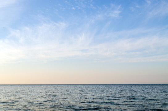 Beautiful sea, horizon with blue sky and clouds