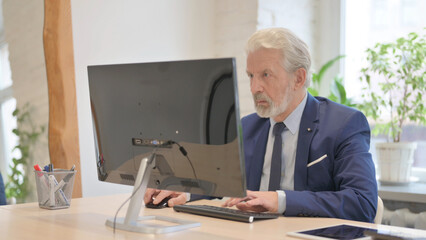 Busy Senior Old Businessman Working on Computer