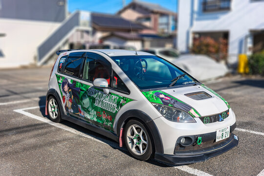 saitama, kawagoe - dec 31 2022: Mitsubishi Colt Ralliart Version-R decorated by a vinyl wrap illustration of a female idol character of the japanese manga and anime Revue Starlight series.