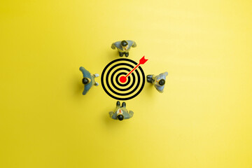 Photo of A group of business people standing in a circle and focus on target board icon use for...