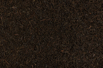 Dry tea leaf. Black tea background.