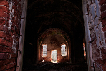 An old ruined temple, a red brick church, inside, windows with iron bars. Architecture, faith.