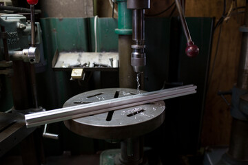 Drilling on the aluminum frame with a drilling machine
