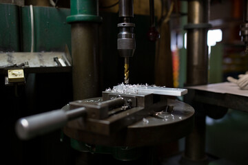 Part machining with drilling machine