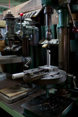 Part machining with drilling machine